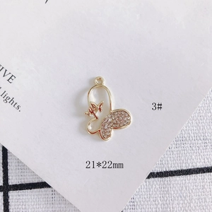 Detailed view of 21x22mm gold butterfly pendant with rhinestones for DIY jewelry making
