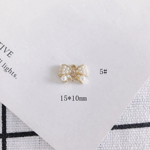 Detail view of 15x10mm alloy butterfly charm with pearls and rhinestone for jewelry DIY