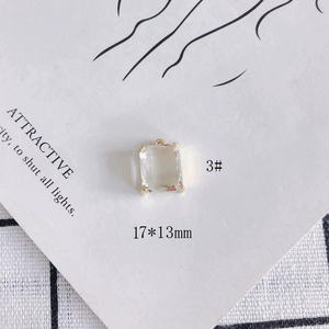 Macro shot of 17x13mm clear rectangular crystal pendant with gold claw setting