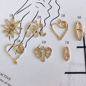 Set van 7 vergulde DIY sieradenhangers met hart-, olifant- en zonnebloemvormen