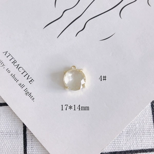 Detail of 17x14mm clear faceted glass crystal pendant with gold 4-prong setting