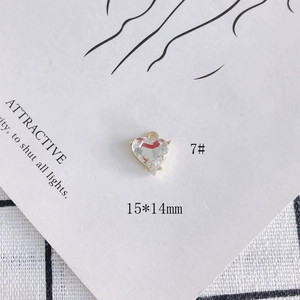 Macro detail of 15x14mm heart crystal pendant with gold edge for DIY jewelry making