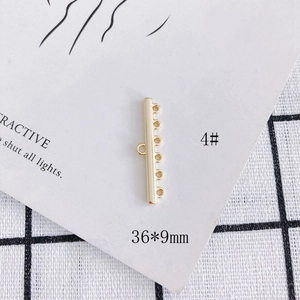 Macro shot of 36x9mm gold plated multi-strand connector with 5 loops for DIY jewelry making