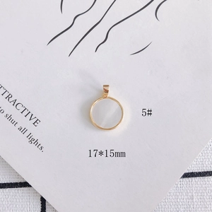 Detail of 18k gold plated shell pendant with diamond inlay for DIY jewelry making