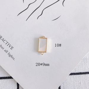 Close-up of 20x9mm shell connector with 18k gold plating for DIY jewelry making