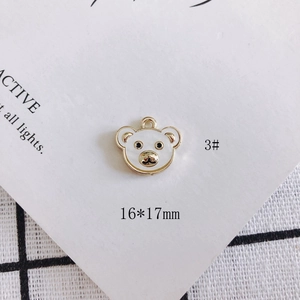Detail of 16x17mm white enamel bear charm with gold alloy edges for DIY jewelry