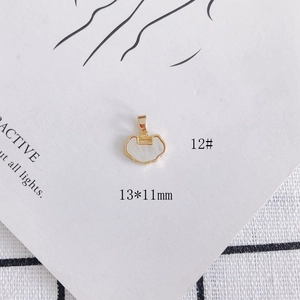 Detailed macro shot of 13x11mm gold plated shell lock pendant with dimensions on props