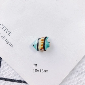 Detail of 15x13mm colorful fish ceramic bead for DIY jewelry with hand-painted glaze