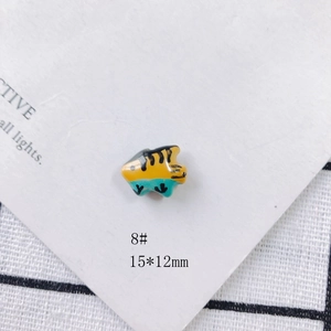 Macro shot of 15x12mm colorful fish ceramic bead for DIY jewelry making accessories