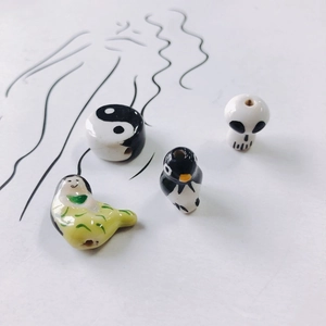 DIY ceramic beads set featuring cartoon penguin, skull, and yin-yang jewelry pendants