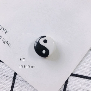 Macro detail of a 17x17mm Tai Chi Yin Yang ceramic pendant for DIY jewelry making