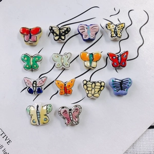 Hand-painted butterfly ceramic beads in various colors for DIY jewelry making and crafts