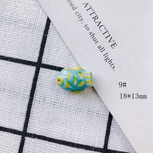 Blue ceramic fish pendant with yellow spots for DIY jewelry making, size 18x13mm