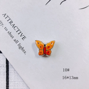 Macro view of 16x13mm orange butterfly ceramic bead accessory for DIY jewelry making