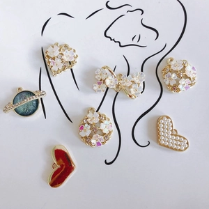 DIY gold plated charm pendants including heart, flower and saturn motifs with pearls