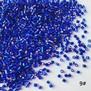 Macro shot of 2mm royal blue silver-lined glass bugle beads for DIY jewelry making