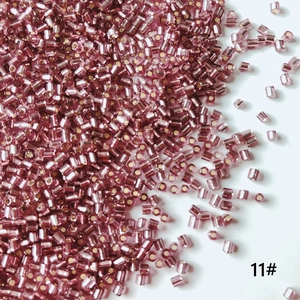 Macro shot of 2mm silver-lined light purple glass bugle beads for DIY jewelry making