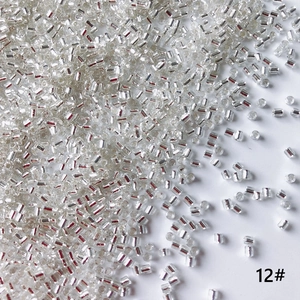 Macro shot of 2mm silver-lined bugle beads for DIY jewelry and beaded crafts