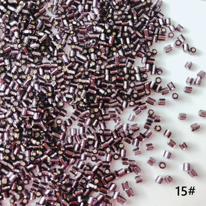 Macro shot of 2mm silver-lined purple glass tube beads for DIY jewelry making