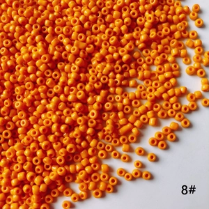 Détail des perles de rocaille orange de 2mm en verre pour la fabrication de bijoux DIY
