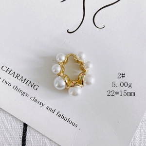 Detail of 22x15mm gold fishtail rabbit pendant with white faux pearls on a display card