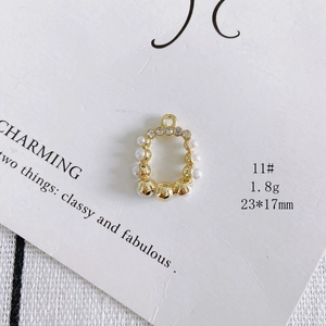Detailed macro view of 23x17mm gold alloy rabbit head pendant with faux pearls and rhinestones
