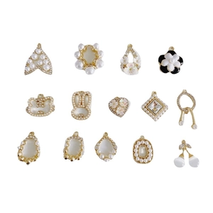 DIY jewelry charm set with gold alloy base featuring pearls and flower shapes on white background
