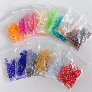 Detail of 4mm matte colorful beads sorted in transparent bags for DIY jewelry making
