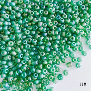 Macro detail of 4mm teal frosted aurora seed beads for DIY handmade jewelry crafts