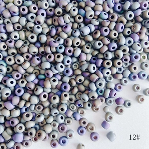 Macro shot of 4mm frosted blue-purple gradient glass seed beads for DIY jewelry making