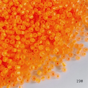 Close-up of 4mm matte orange frosted glass beads for DIY jewelry making and crafts