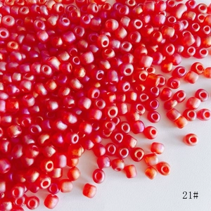 Macro shot of 4mm frosted red glass seed beads for DIY jewelry making and crafting projects
