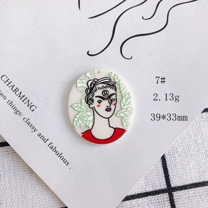 Acrylic cartoon pendant with female portrait relief and floral background details