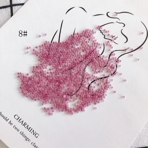 Creative 2mm pink glass seed beads displayed as a dress on a fashion illustration card