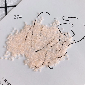 Close-up of 2mm light pink glass seed beads style 27 for DIY jewelry making