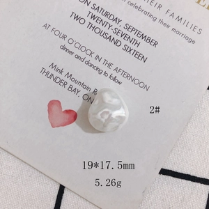 Close-up of a cream white baroque irregular pearl bead showing texture and 19x17.5mm size