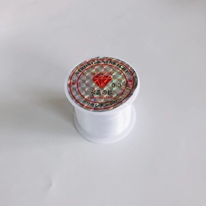 Detail of 0.3mm clear stretchy crystal line on spool for DIY jewelry making