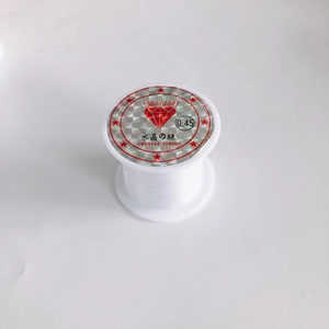 Macro view of 0.45mm clear non-elastic crystal string spool for jewelry making