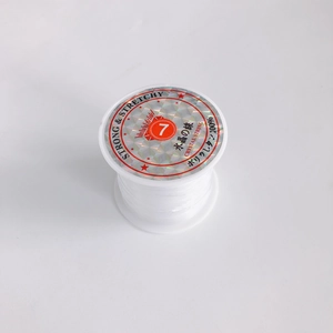 Close-up of 0.7mm clear elastic crystal string roll for DIY jewelry making