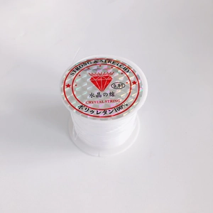 Macro shot of 0.8mm transparent elastic crystal string spool for DIY jewelry making