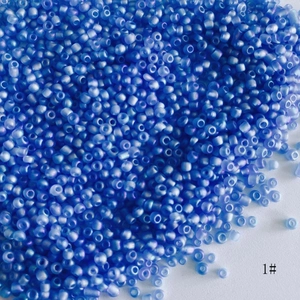 Close-up of 2mm frosted AB cobalt blue glass seed beads for DIY jewelry making