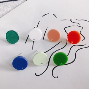 Colorful minimalist acrylic round stud earrings set in seven vibrant colors on art background