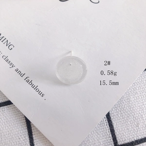 Detailed view of 15.5mm translucent acrylic earring with white glitter and 0.58g weight