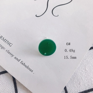 Macro detail of 15.5mm green acrylic round bead for DIY jewelry making accessories
