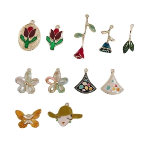 Assorted DIY alloy enamel charms featuring flowers, butterflies, and colorful floral designs