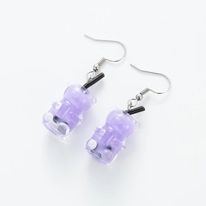 Detailed view of purple resin gummy bear drink bottle earrings with silver hooks