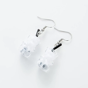Detailed close-up of clear resin gummy bear earrings with boba tea straw design