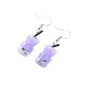 Creative purple resin gummy bear bubble tea earrings with metal hooks on white background