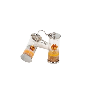 Silver drop earrings with glass bottles featuring yellow dried flowers in a nature style