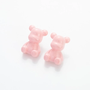 Glossy pink resin strawberry bear stud earrings in a cute 3D cartoon sitting pose
